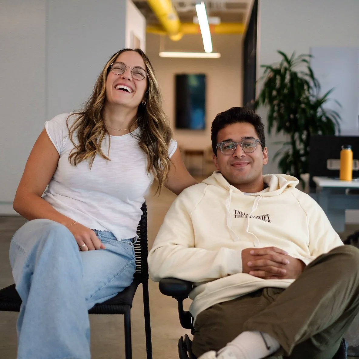 Two Whatnot interns laughing together at the office